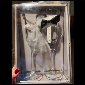bride and groom toasting glasses